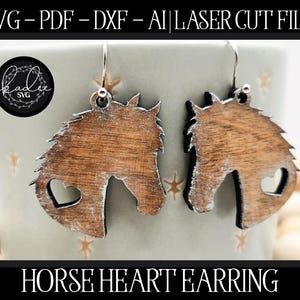 May include: Wooden horse head earrings with a heart-shaped cutout. The earrings are brown with white accents and hang from silver hooks. The image also includes the text "HORSE HEART EARRING".