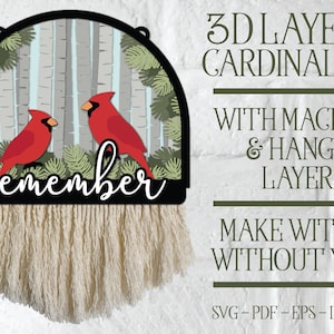 May include: A 3D layered cardinal sign with the word "remember" in black lettering. The sign features two red cardinals in a birch tree forest setting. The sign is designed to be hung with macrame and includes hanger layers. The sign can be made with or without yarn.