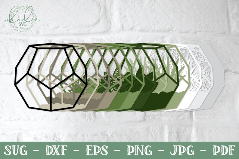 May include: A set of layered geometric shapes in various shades of green, beige, and white. The shapes are arranged in a row, with the largest shape at the back and the smallest shape at the front. The shapes are all in the form of a hexagon with a geometric pattern inside.
