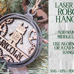 May include: Laser cut wooden robot ornament with a gear design. The ornament is round and has a space for a name in the middle. The text "LINCOLN" is visible on the ornament.  SVG-EPS-PDF-PNG-AI