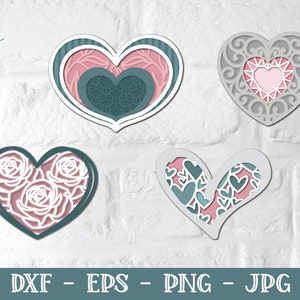 Pu&ograve; includere: Quattro diversi design a forma di cuore con intricati tagli. I cuori sono in tonalit&agrave; di rosa, grigio e verde acqua. I design includono motivi floreali, volute e cuori all'interno di cuori.