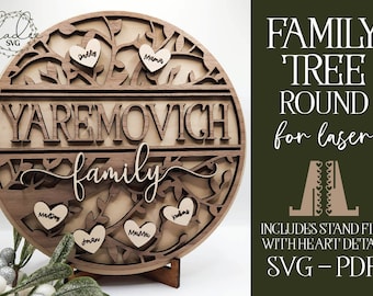 May include: A round wooden family tree with a laser-cut design. The tree has branches with leaves and hearts. The name "YAREMOVICH family" is written on the tree. The tree is on a wooden stand. The image includes a separate file for a stand with a heart detail.