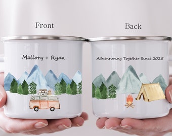 May include: Two white enamel mugs with a mountain and forest scene. The front mug says "Mallory + Ryan" and features a vintage camper van. The back mug says "Adventuring Together Since 2025" and features a tent and campfire.