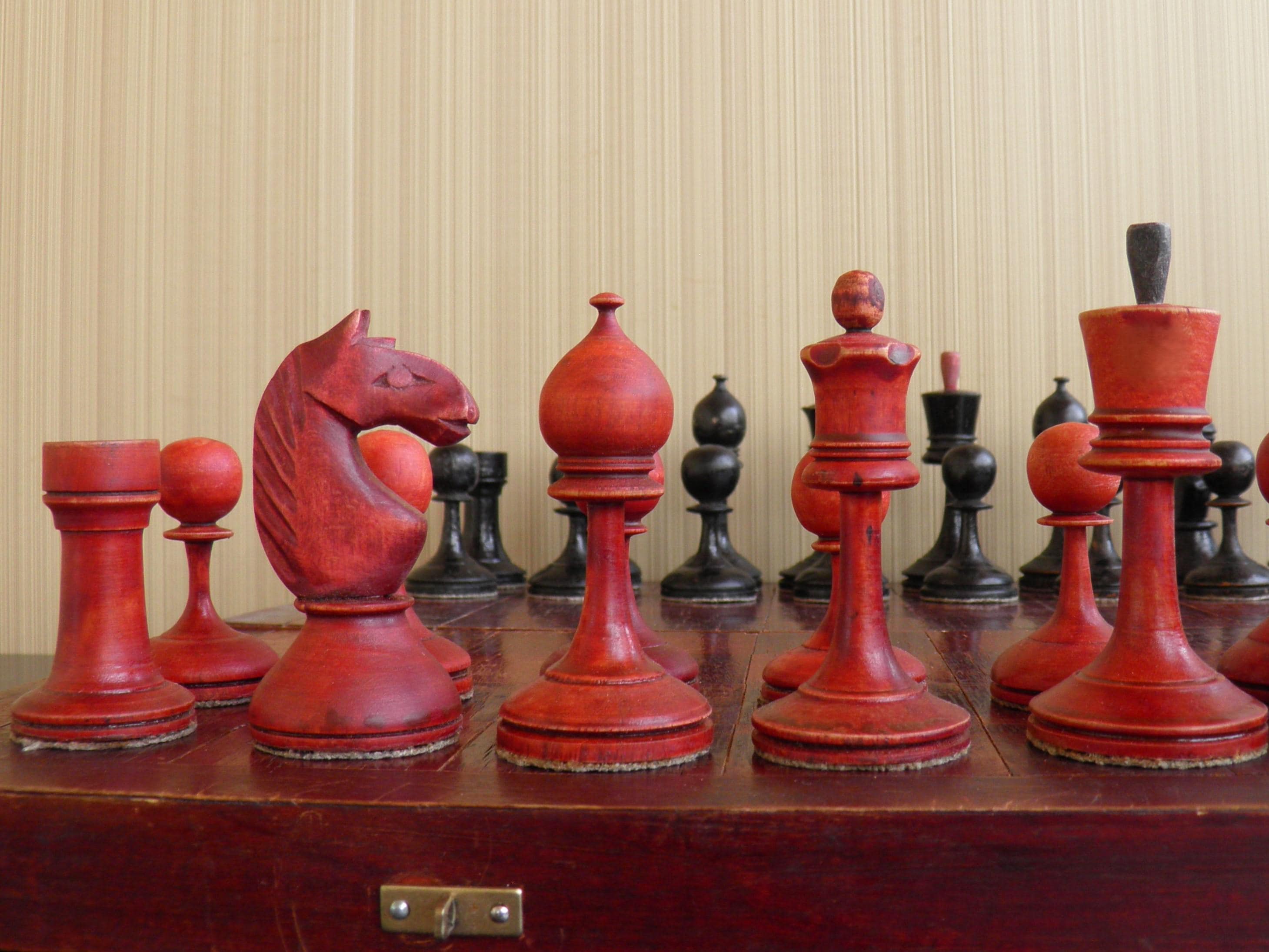 Old chess. Vintage Soviet weighted chess 1920s and 1940s. Chess with kettlebells, chess set with weighting materials. Antique wooden chess.