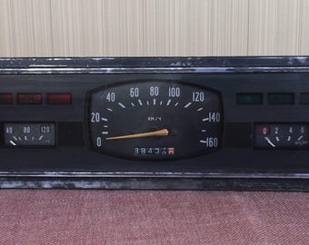 Vintage dashboard. Old dashboard of a Soviet-era car. Automotive industry of the USSR. Speedometer from the Soviet car. Loft Decor element.