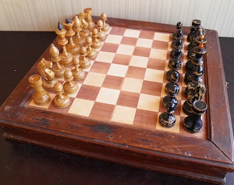 Vintage, Soviet, wooden chess from the 40s and 50s with a beautiful patina. Old, rare, chess set and original chessboard in good condition.