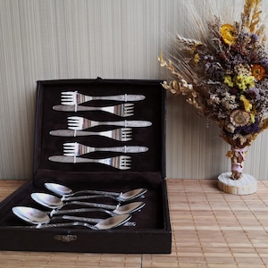 Vintage, gift, Soviet set of 12 items in the original case. Dessert forks and spoons are in good condition. Decoration of the festive table.