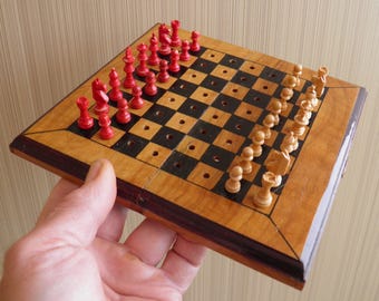 Vintage wooden travel chess set with an original chessboard. Vintage travel chess set. Wooden chess set and wooden board. Vintage chess 60s.