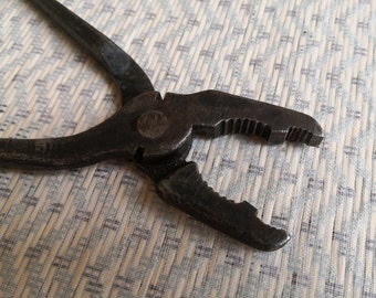 Soviet tools 60s Iron ticks. Blacksmith pliers. Vintage rusty iron tongs. Home workshop. Vintage instrument. Vintage pincers, pliers nippers