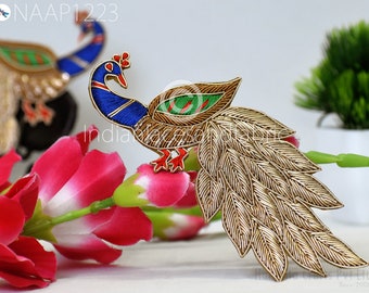 May include: A gold and blue peacock embroidery patch with a green and gold design. The peacock has a long tail of gold feathers. The patch is perfect for adding a touch of elegance to any project.