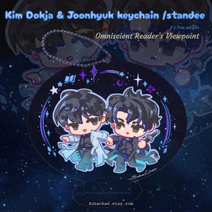 May include: A clear acrylic keychain and standee featuring cartoon illustrations of two characters. The keychain has a silver chain. The standee is black with a starry design and the text "Omniscient Reader's Viewpoint". The dimensions are 8 x 7 cm.