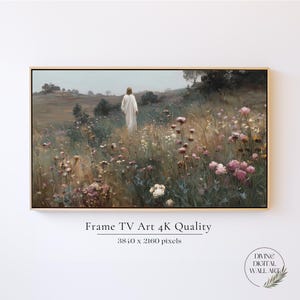 May include: A digital landscape painting in a wooden frame featuring a figure in a white robe walking through a field of pink and white wildflowers under a muted sky. Text below reads: Frame TV Art 4K Quality, 3840 x 2160 pixels.