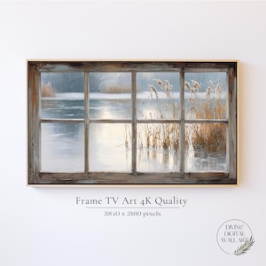 May include: A framed digital art print depicting a winter landscape viewed through a window. The artwork features a serene scene of a snowy lake and reeds, with a wooden window frame. The text "Frame TV Art 4K Quality" is visible.