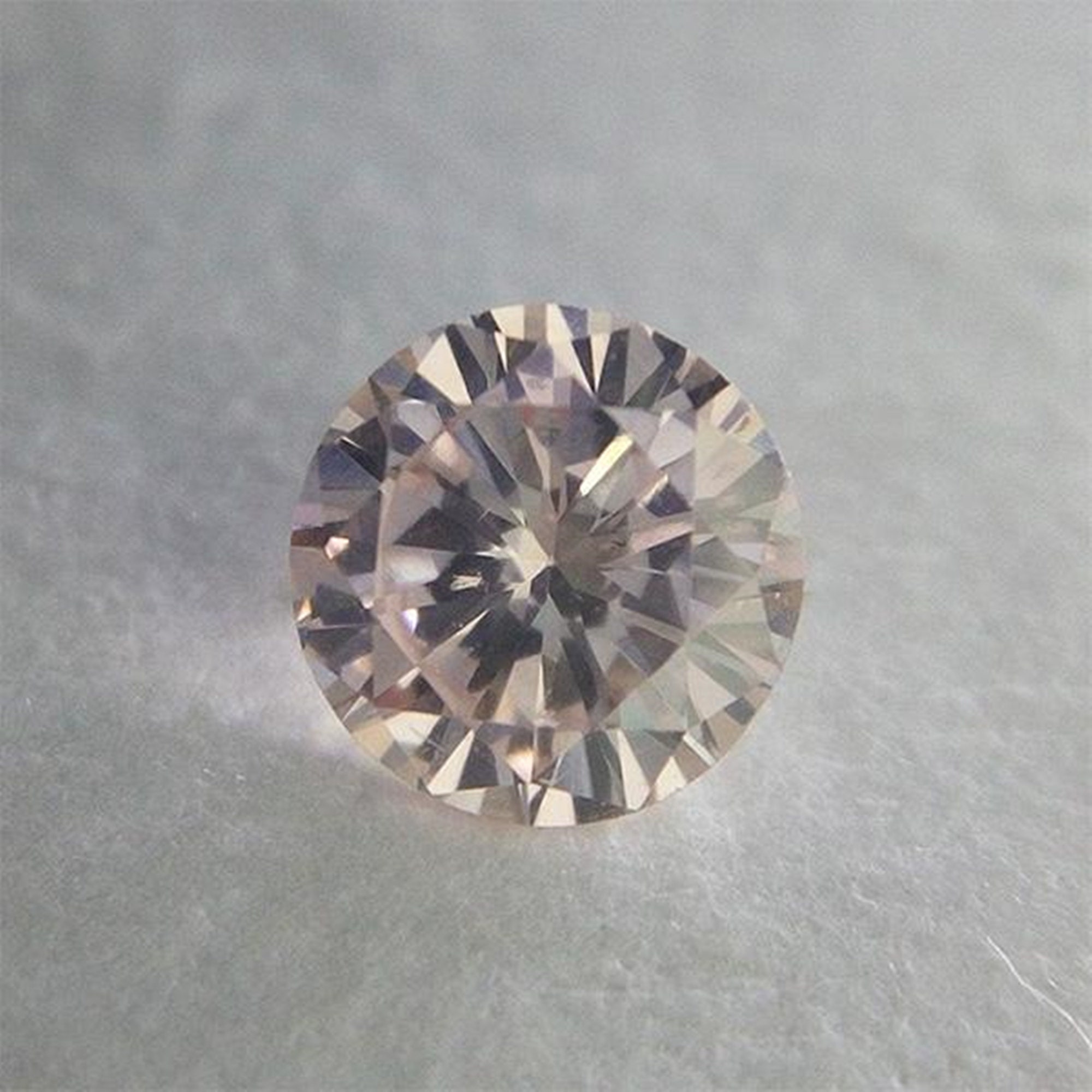 0.192 Ct Fancy Light Orangy Pink VS2 CGL Japan Natural Loose