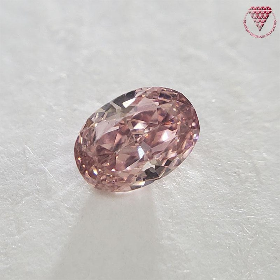 0.104 Carat Fancy Intense Orangy Pink Oval VS2 CGL Japan