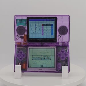 Console Nintendo DS Lite ricondizionata, scocca trasparente viola, aggiornamento per la ricarica tramite USB-C