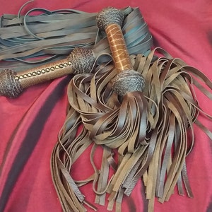 Chocolate Brown Leather Flogger with Ostrich Handle Detail.