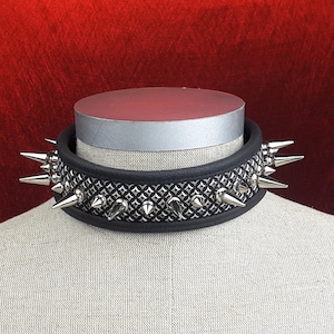 Spikey Leather Collar with long and short spikes on silver inlay.