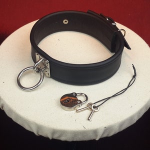 Heavy Leather O-Ring Slave Choker / Collar in Black Leather with lockable buckle and padlock.