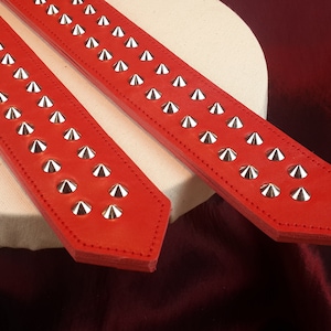 Black Heavy Leather Studded Paddle with blue or black stitching.