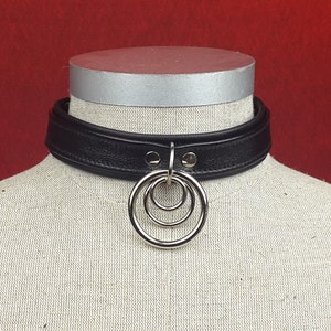 O-Ring Slave Collar with various front O Ring Detail and rear belts and buckles.