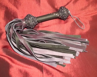 Leather Flogger in purple and black leather.