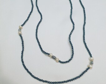 Stylish and bright long necklace with silver-colored hematite beads