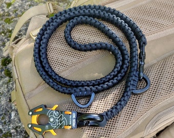 May include: Black paracord lanyard with a black metal hook and a bright orange and black metal carabiner with the text "FROG 360 Made in Italy".