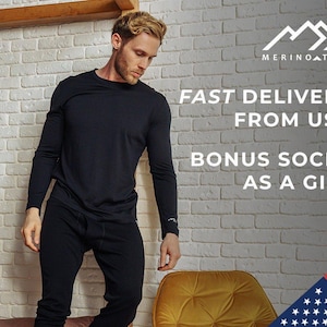 May include: A black long-sleeve shirt and matching black pants. The image includes the text MERINOTECH, FAST DELIVERY FROM USA, and BONUS SOCKS AS A GIFT. A small mountain logo is visible on the shirt sleeve and above the brand name.