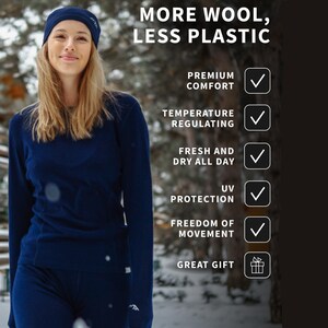 May include: A woman wearing a navy blue beanie, long-sleeve shirt, and pants. The text on the image reads "MORE WOOL, LESS PLASTIC" and lists features like premium comfort, temperature regulating, and UV protection.