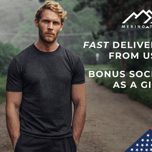 May include: A man wearing a dark grey t-shirt stands in a forest setting. The text "FAST DELIVERY FROM USA BONUS SOCKS AS A GIFT" is displayed above him. The image also includes a logo with the text "MERINOATECH" and a partial image of the American flag.