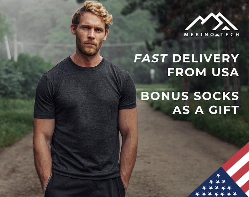 May include: A man wearing a dark grey t-shirt stands in a forest setting. The text "FAST DELIVERY FROM USA BONUS SOCKS AS A GIFT" is displayed above him. The image also includes a logo with the text "MERINOATECH" and a partial image of the American flag.