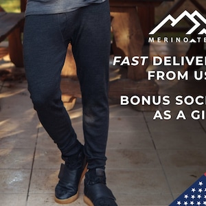 May include: A person wearing black pants and black shoes. The text "MERINO TECH" is in the upper right corner of the image. The text "FAST DELIVERY FROM USA" is below the logo. The text "BONUS SOCKS AS A GIFT" is below the delivery text. A portion of the American flag is in the lower right corner of the image.
