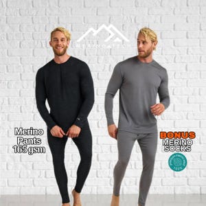 May include: Two sets of long-sleeve base layer shirts and pants. One set is charcoal gray, the other is light gray. Text reads Merino Tech, Merino Pants 165 gsm, and Bonus Merino Socks with a circular 100% merino wool logo badge included.