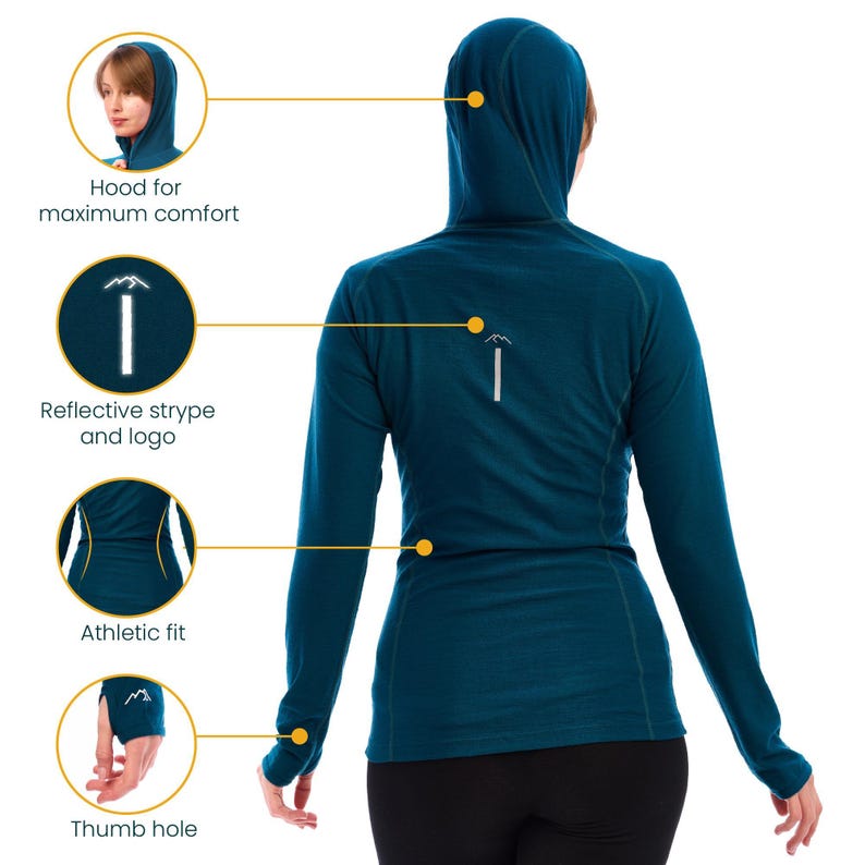 May include: Teal long-sleeve athletic shirt with a hood. Features include a reflective stripe and logo, thumb holes, and an athletic fit. The hood is designed for maximum comfort.