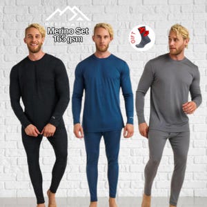 May include: A three-piece Merino Tech set featuring long-sleeve shirts and leggings in black, blue, and gray. The text reads Merino Tech, Merino Set, 165 gsm, and Gift. A small circular graphic shows a pair of gray socks with red accents.