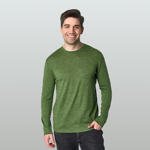 May include: A long-sleeve crew neck shirt in a heathered olive green color. The garment features a simple, solid-colored design with a ribbed neckline and long sleeves, providing a basic and functional style for everyday wear in various settings.
