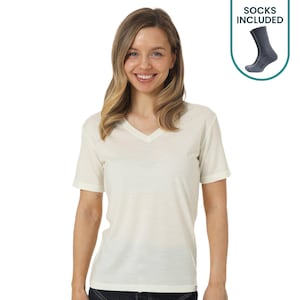 May include: A short-sleeved, cream-colored V-neck t-shirt with a simple, solid design. In the upper right corner, a graphic label displays a pair of dark gray socks with the text SOCKS INCLUDED, indicating that a pair of socks is included.