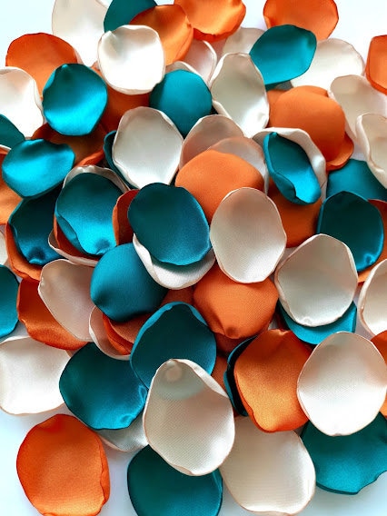 Orange teal blue flowers Champagne ivory rose petals Burnt orange wedding Ivory wedding