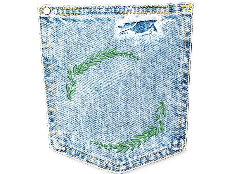 May include: A blue denim pocket with a green embroidered wreath design.