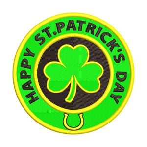 May include: Embroidered patch with a green shamrock and horseshoe on a black background, surrounded by a green ring with the text "HAPPY ST. PATRICK'S DAY" in white. The patch has a yellow border.
