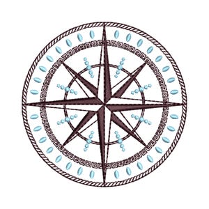 May include: Embroidered compass rose design in shades of brown and blue. The compass features a central star shape, surrounded by a Greek key pattern and a rope-like border. Small blue oval shapes and clusters of blue dots add detail.