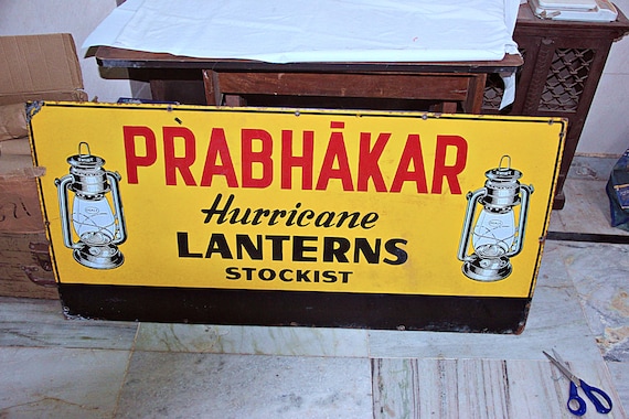 48x24” Prabhakar Hurricane Lanterns Stockist Porcelain Enamel Tin Sign, Vintage Retro Advertising Collectible for Industrial or Rustic Décor