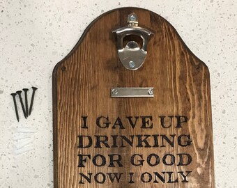 Wood burned wall mounted bottle opener with magnetic cap catches