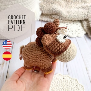 May include: Crochet pattern PDF for a brown and white amigurumi horse. The pattern is available in both English and Spanish.
