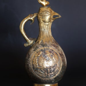 Elegant, Chinese phoenix shaped Han-Tang made gilt bronze ceremonial vine ever