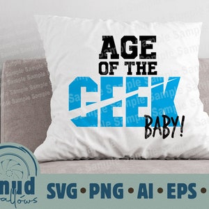 May include: White pillow with blue and black text that reads "Age of the Geek Baby!"