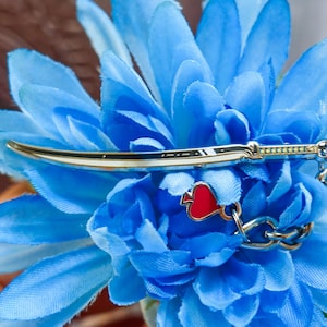 A Hunter&#39;s Charmed Katana Enamel Pin