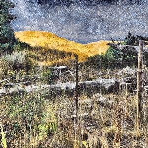 Worn Fence Under Dark Skies Light on Background Mountain image 2