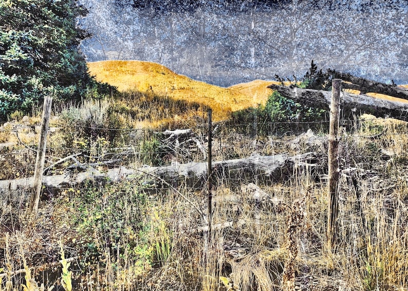 Worn Fence Under Dark Skies Light on Background Mountain image 2